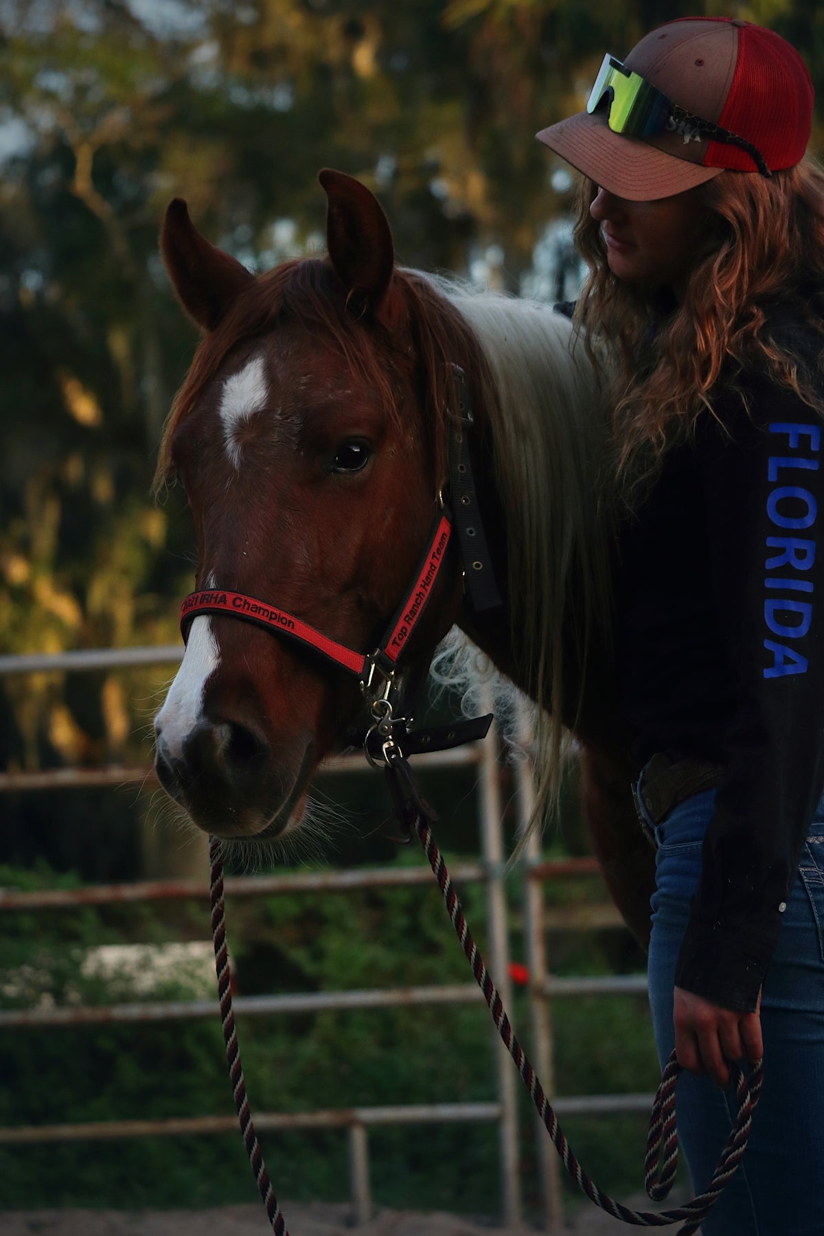 a woman is standing next to a horse