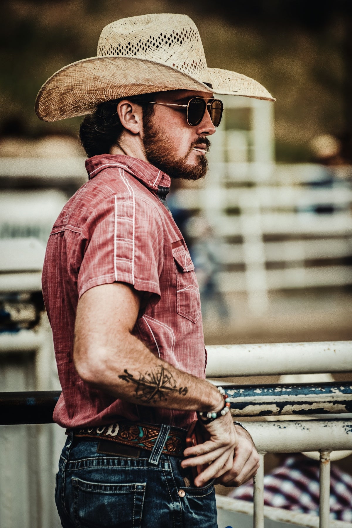 A man wearing a cowboy hat and sunglasses