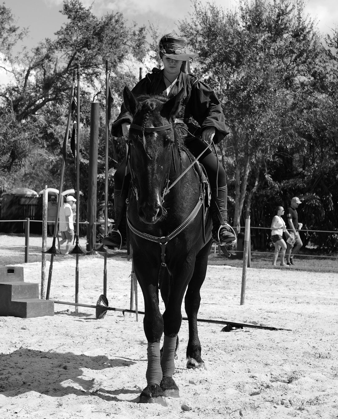 A man riding on the back of a brown horse