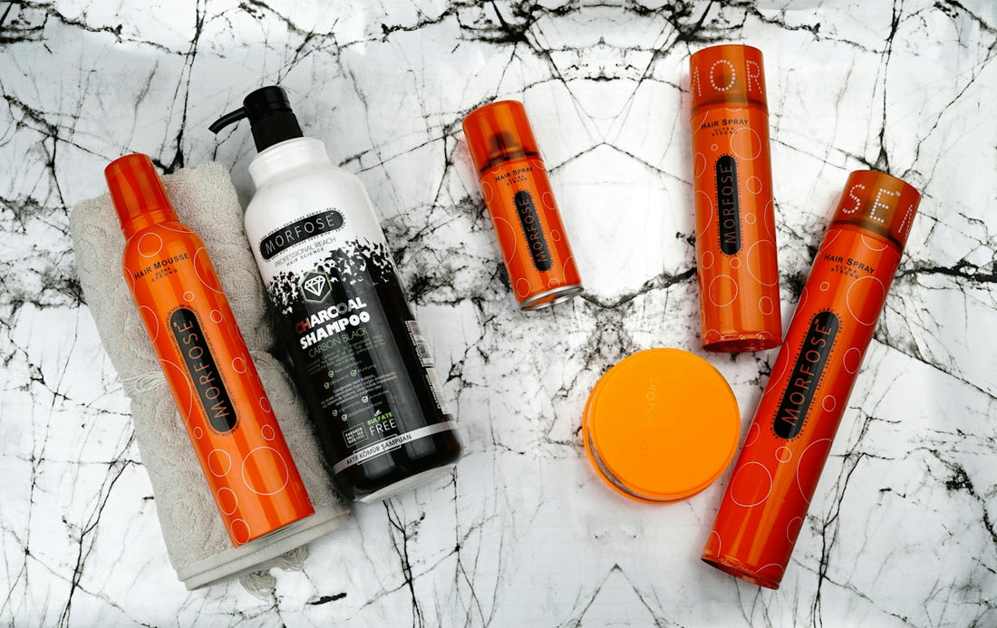 Beauty products are arranged on a marble surface
