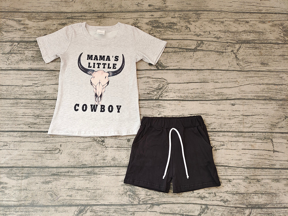 Baby boys' Mama's Little Cowboy gray T-shirt and black shorts laid flat on wood