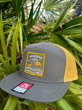 Bayed Up Patch 7-panel trucker hat in charcoal and old gold