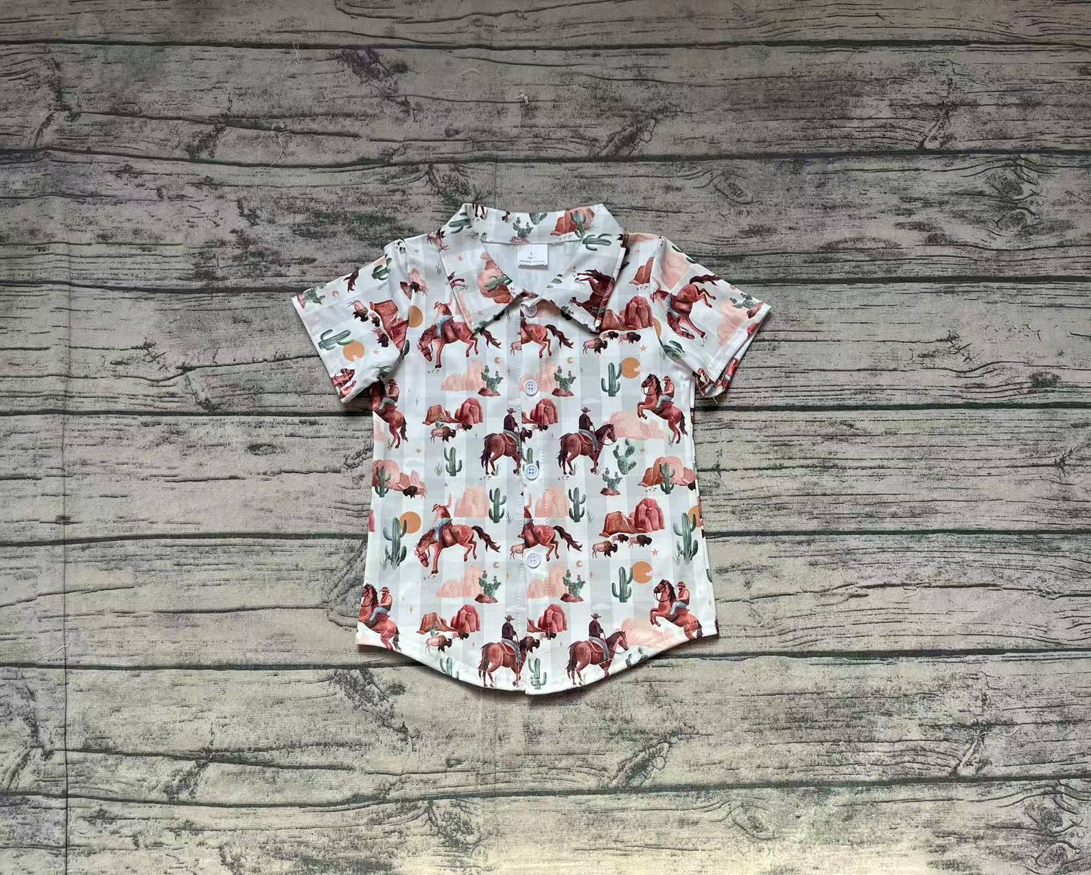 Boys' western cattle and cactus short-sleeve button-up shirt laid flat