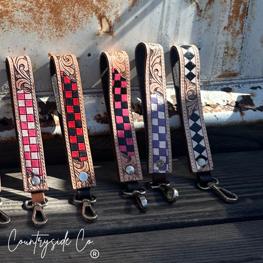Checkered tooled leather wristlet keychain detail
