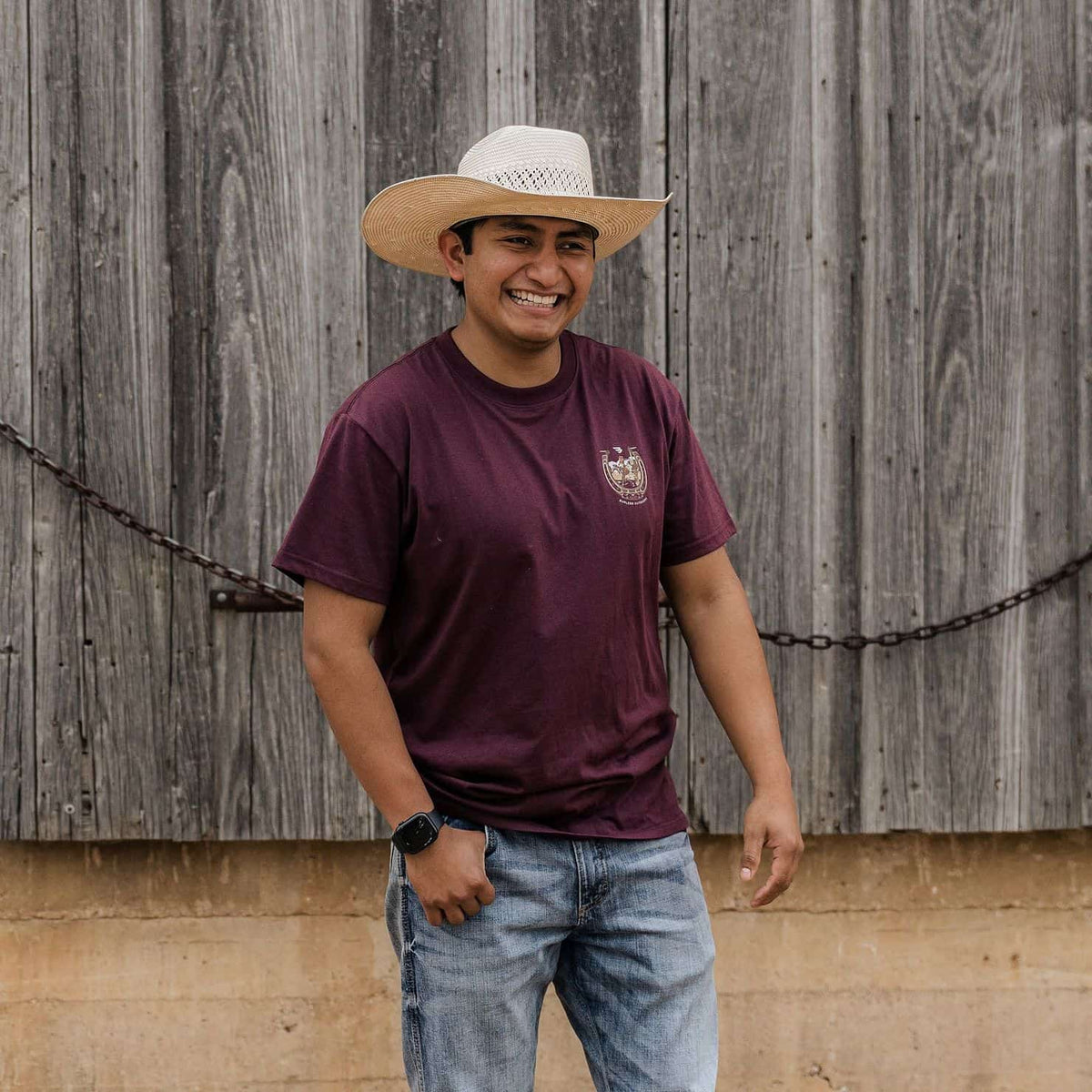 Man in cowboy hat wearing BURLEBO Horseshoe Maroon Tee