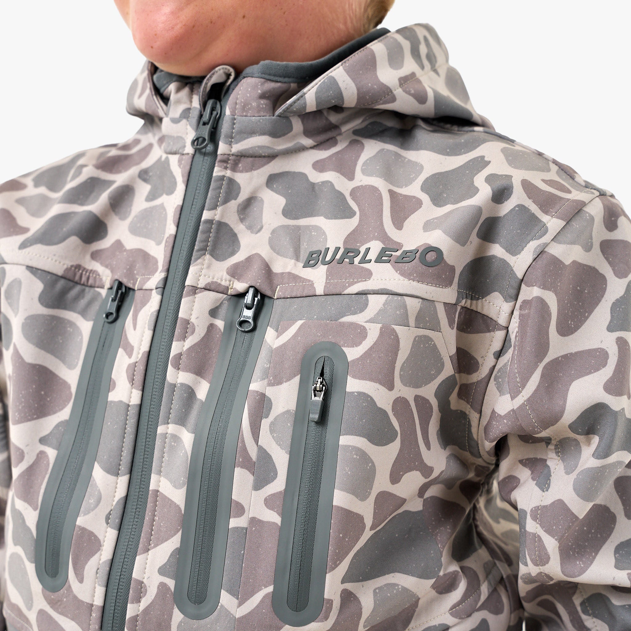 Youth wearing the BURLEBO Classic Deer Camo Challenger Jacket