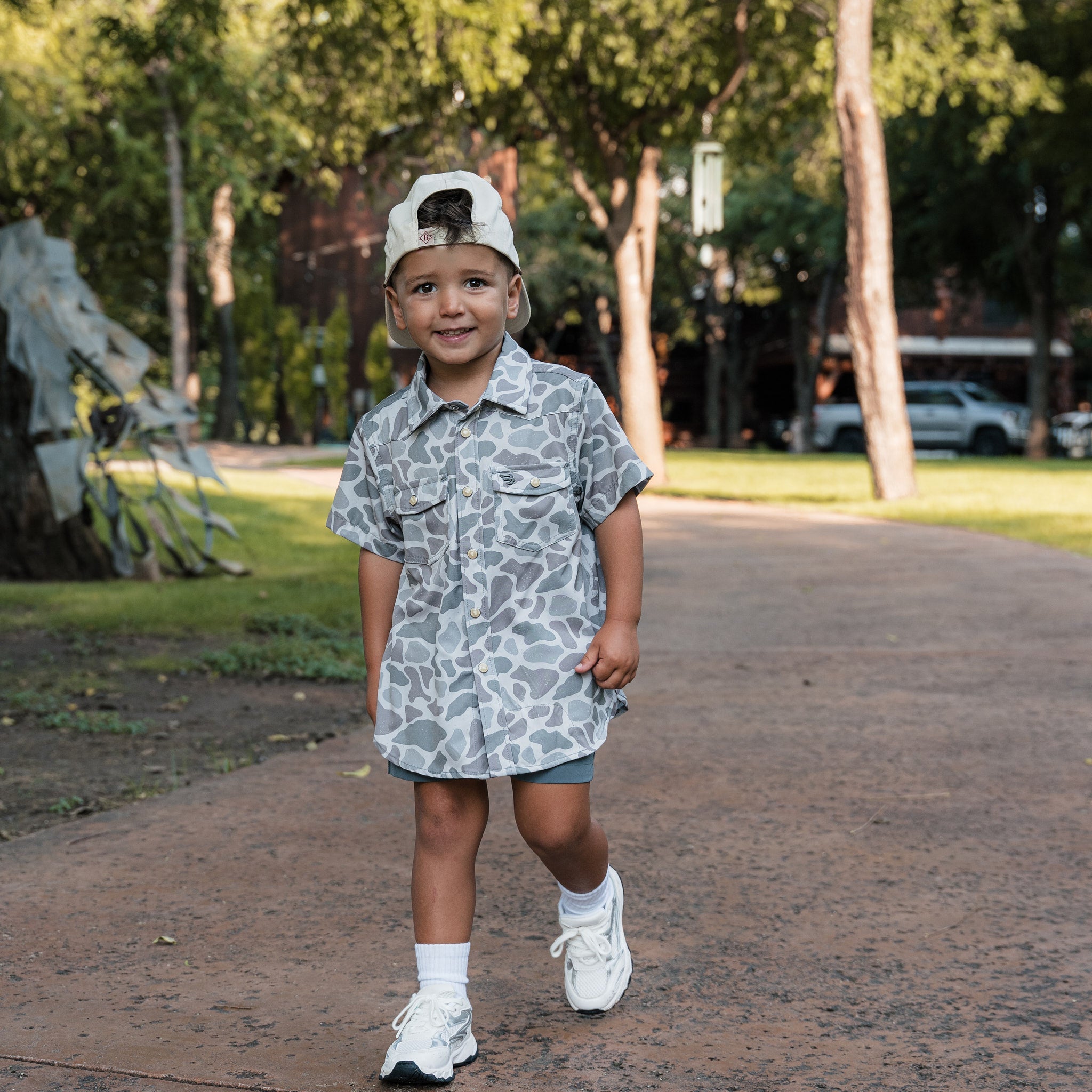Youth wearing the BURLEBO Classic Deer Camo performance western shirt