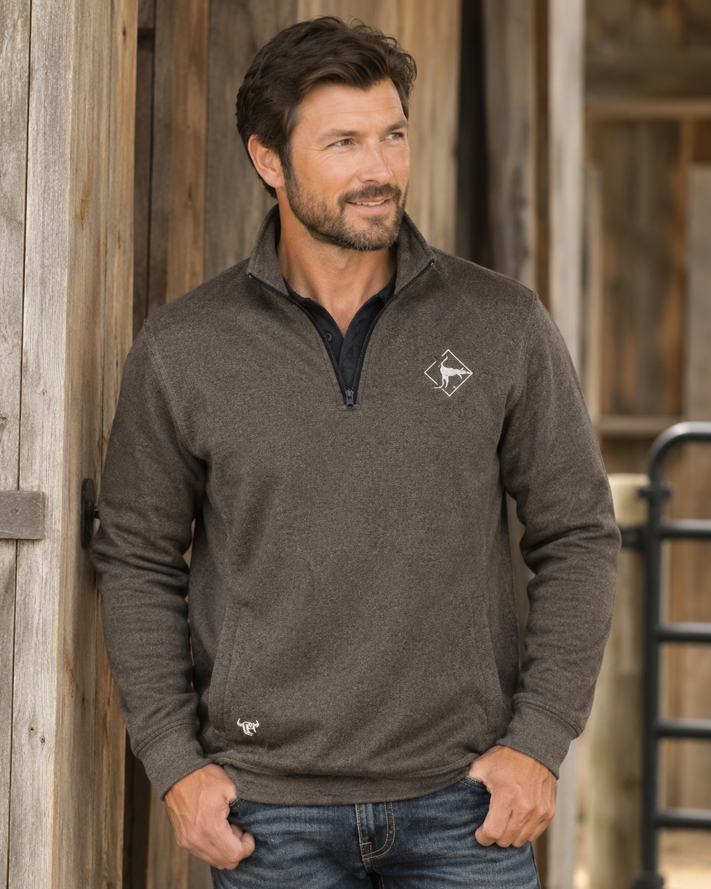 Male model wearing Cowboy Hardware quarter-zip pullover in dark brown