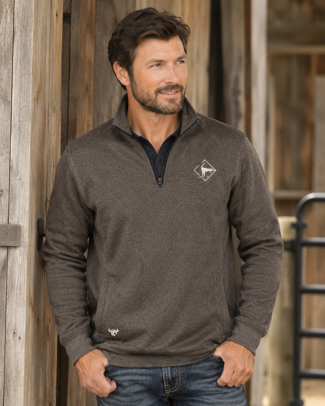 Male model wearing Cowboy Hardware quarter-zip pullover in dark brown