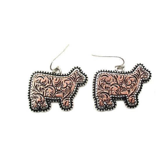 Snowing West Western etched cow dangle earrings in Copper