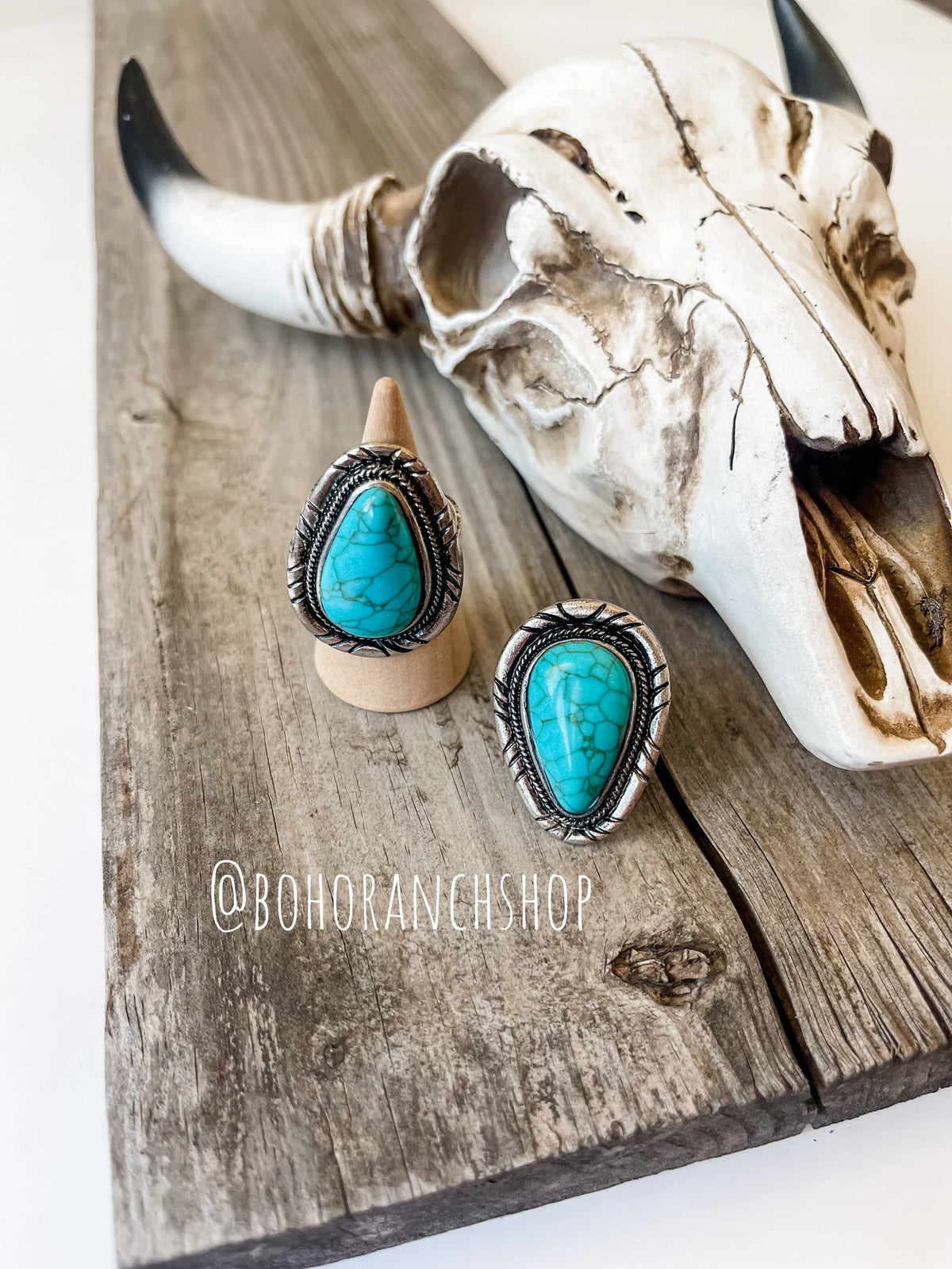 Western teardrop turquoise stone cuff rings on display