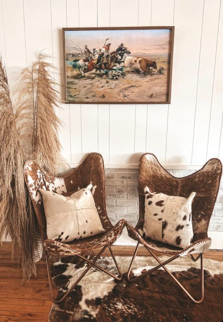 Cowhide butterfly chairs in a western-inspired room